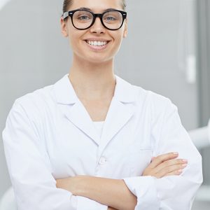 female-dentist-posing-in-office-H89D7UA