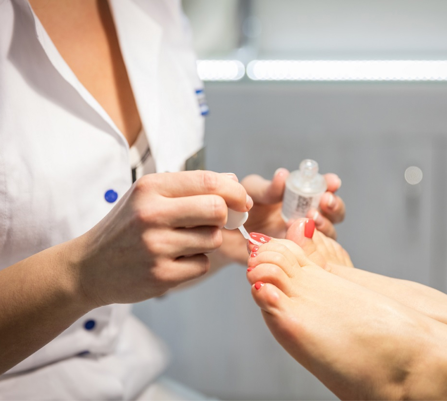 cropped-view-of-woman-getting-a-pedicure-at-beauty-PK8EVY5